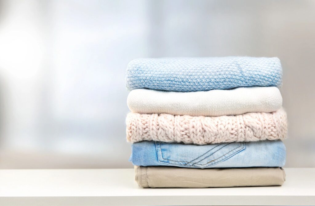 Stack of clothes empty copy space.