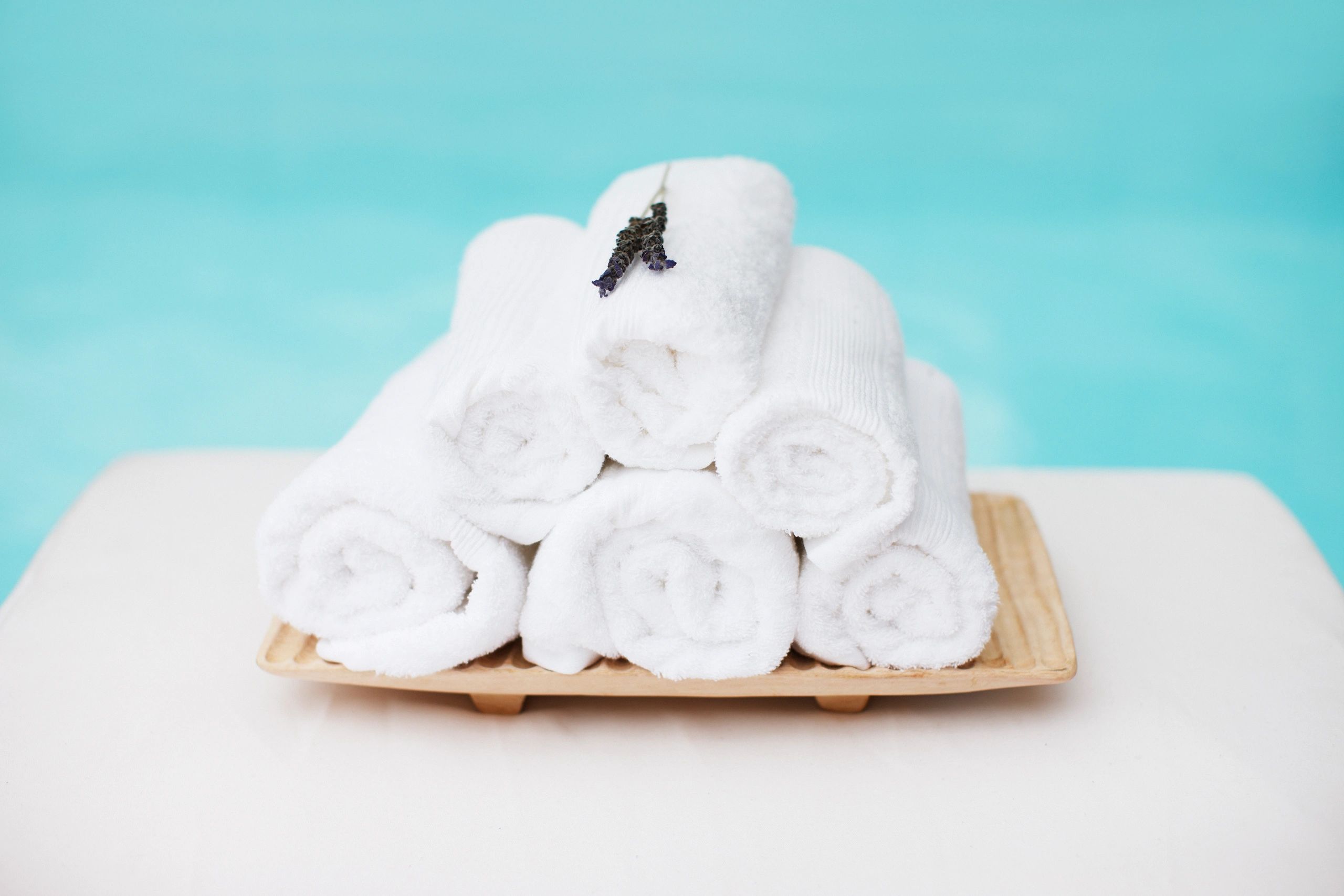 Folded towels representing laundry and turnover service