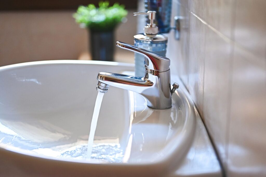 Water running a modern bathroom.